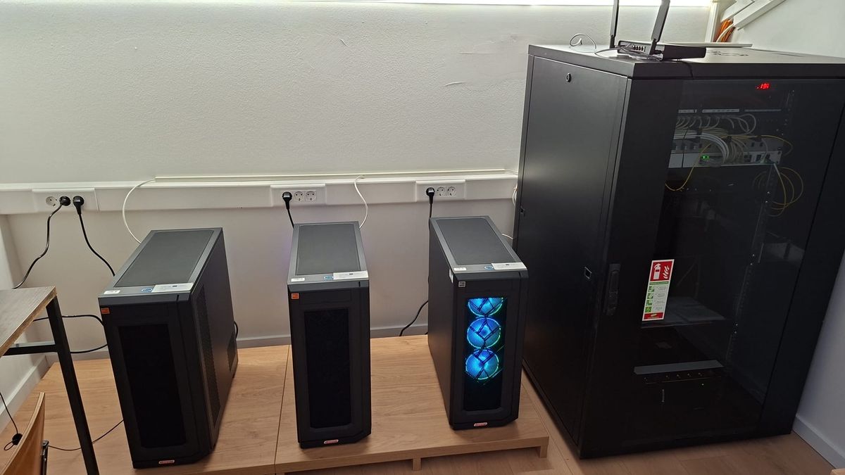 Three LACMIS GPU workstations and a network rack in the laboratory